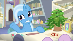 Size: 1600x900 | Tagged: safe, screencap, phyllis, starlight glimmer, trixie, pony, unicorn, a horse shoe-in, g4, bookshelf, desk, female, folder, hooves, house plant, mare, mints, office, philodendron, picture frame, raised eyebrow, raised hoof, scroll, shelf