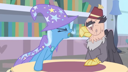 Size: 1594x900 | Tagged: safe, screencap, grampa gruff, trixie, griffon, pony, unicorn, a horse shoe-in, g4, blind eye, book, bookshelf, breath, cape, clothes, female, hat, lamp, library, male, mare, trixie's cape, trixie's hat, yelling