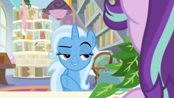 Size: 1600x900 | Tagged: safe, screencap, phyllis, starlight glimmer, trixie, pony, unicorn, a horse shoe-in, g4, book, bookshelf, ceiling light, desk, female, globe, house plant, lidded eyes, mare, office, philodendron, potted plant, raised eyebrow, raised hoof, scroll, shelf, window