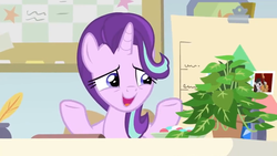 Size: 1600x900 | Tagged: safe, screencap, octavia melody, phyllis, starlight glimmer, pony, unicorn, a horse shoe-in, g4, bulletin board, chart, desk, female, house plant, inkwell, mare, nervous smile, office, philodendron, photo, quill, shrug