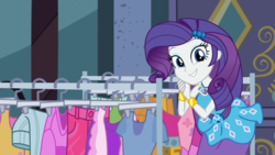 Size: 989x558 | Tagged: safe, screencap, rarity, equestria girls, equestria girls series, g4, street chic, spoiler:eqg series (season 2), belt, bending, bracelet, breaking the fourth wall, clothes, cute, cutie mark on clothes, eyeshadow, female, frilly design, geode of shielding, gold, grin, hairpin, jewelry, magical geodes, makeup, pencil skirt, pendant, rarity peplum dress, skirt, sleeveless, smiling, solo, talking to viewer, tank top