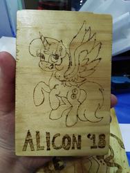 Size: 439x585 | Tagged: safe, artist:dawn-designs-art, artist:sapphire-burns-art, oc, oc:spheres, alicorn, pony, convention mascots, convention:alicon, mascot, photo, pyrography, solo, traditional art