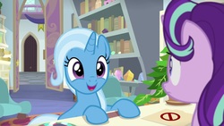 Size: 1920x1080 | Tagged: safe, screencap, phyllis, starlight glimmer, trixie, pony, unicorn, a horse shoe-in, g4, bookshelf, cute, diatrixes, duo, excited, eyes closed, female, folder, frown, happy, hooves on the table, mare, open mouth, philodendron, school of friendship, smiling, starlight's office, too cute