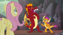 Size: 1920x1080 | Tagged: safe, screencap, fluttershy, garble, smolder, dragon, pegasus, pony, g4, sweet and smoky, angry, brother and sister, butt, defensive, displeased, fangs, female, folded wings, frown, horns, little sister, looking at each other, male, mare, plot, pointing, siblings, smolder is not amused, teenaged dragon, teenager, unamused, wings
