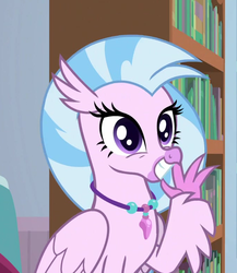 Size: 676x780 | Tagged: safe, screencap, silverstream, classical hippogriff, hippogriff, a horse shoe-in, g4, bookshelf, claws, cropped, cute, diastreamies, female, folded wings, grin, jewelry, looking at you, necklace, pearl necklace, sitting, smiling, solo, squee, talons, teenager, waving, wings