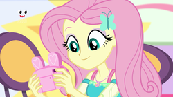 Size: 1280x720 | Tagged: safe, screencap, fluttershy, equestria girls, equestria girls specials, g4, my little pony equestria girls: better together, my little pony equestria girls: holidays unwrapped, camera, clothes, female, geode of fauna, magical geodes, pink camera, plusplus, smiling