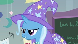 Size: 1920x1080 | Tagged: safe, screencap, trixie, pony, unicorn, a horse shoe-in, g4, cape, clothes, female, grin, hat, mare, smiling, solo, trixie's cape, trixie's hat