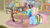 Size: 1600x900 | Tagged: safe, screencap, a.k. yearling, fluttershy, rainbow dash, pegasus, pony, daring doubt, g4, book, bookshelf, cape, clothes, couch, female, glasses, mare, pen, sad, saddle bag, shelf, sign, sitting, stool, table