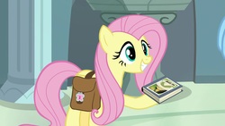 Size: 1920x1080 | Tagged: safe, screencap, fluttershy, pegasus, pony, daring doubt, g4, betrayal, book, cute, daring do and the fallen idol, daring do book, folded wings, grin, rainbow dash's house, saddle bag, smiling, traitor, wings