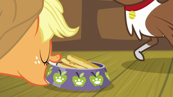 Size: 1280x720 | Tagged: safe, screencap, applejack, winona, dog, earth pony, pony, g4, going to seed, female, food, mare, mouth hold, pancakes, paw prints, pet bowl