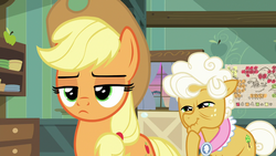 Size: 1280x720 | Tagged: safe, screencap, applejack, goldie delicious, pony, g4, going to seed, duo, frown, lidded eyes