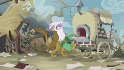 Size: 2100x1181 | Tagged: safe, screencap, gilda, griffon, g4, the lost treasure of griffonstone, cart, female, frown, griffon scone, griffonstone, looking back, oven mitts, solo