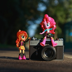 Size: 3640x3640 | Tagged: safe, artist:artofmagicpoland, pinkie pie, sunset shimmer, equestria girls, g4, 35mm camera, doll, equestria girls minis, eqventures of the minis, female, high res, lesbian, ponk, ship:sunsetpie, shipping, sitting, slr, toy, zenit