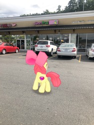 Size: 3024x4032 | Tagged: safe, gameloft, photographer:undeadponysoldier, apple bloom, earth pony, pony, g4, augmented reality, building, car, cutie mark, female, filly, irl, parking lot, photo, ponies in real life, solo, sweet frog, the cmc's cutie marks