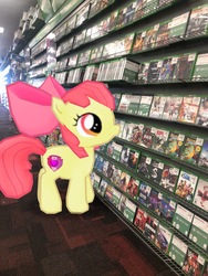 Size: 3024x4032 | Tagged: safe, gameloft, photographer:undeadponysoldier, apple bloom, earth pony, pony, g4, augmented reality, female, filly, gamestop, irl, photo, ponies in real life, solo, united states, xbox one