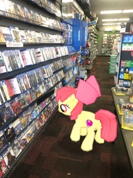 Size: 3024x4032 | Tagged: safe, gameloft, photographer:undeadponysoldier, apple bloom, earth pony, pony, g4, augmented reality, female, filly, gamestop, irl, photo, playstation 4, ponies in real life