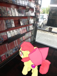 Size: 3024x4032 | Tagged: safe, gameloft, photographer:undeadponysoldier, apple bloom, earth pony, pony, g4, augmented reality, female, filly, gamestop, irl, nintendo switch, photo, ponies in real life