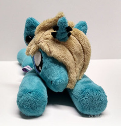 Size: 400x417 | Tagged: safe, artist:catnapcaps, pony, unicorn, as it is, beanie (plushie), commission, ear piercing, gauges, hair over one eye, horn, horn piercing, irl, male, nose piercings, patty walters, photo, piercing, plushie, ponified, prone, solo, stallion