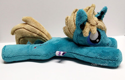 Size: 600x383 | Tagged: safe, artist:catnapcaps, pony, unicorn, as it is, beanie (plushie), commission, ear piercing, gauges, hair over one eye, horn, horn piercing, irl, male, nose piercing, patty walters, photo, piercing, plushie, ponified, prone, solo, stallion