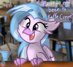 Size: 1092x1006 | Tagged: safe, artist:rainbow eevee, silverstream, classical hippogriff, hippogriff, g4, cheek fluff, crepe, cute, dialogue, diastreamies, female, irl, kaffe crepe, looking at you, missing accessory, photo, restaurant, solo, table, text