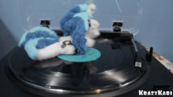Size: 500x280 | Tagged: safe, artist:krazykari, dj pon-3, vinyl scratch, pony, unicorn, g4, animated, female, gif, irl, loop, perfect loop, photo, plushie, ponies in real life, smiling, spinning, turntable, turntable pony