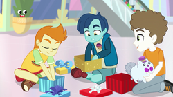 Size: 1280x720 | Tagged: safe, screencap, gallop j. fry, henry handle, manestrum, super funk, equestria girls, equestria girls specials, g4, my little pony equestria girls: better together, my little pony equestria girls: holidays unwrapped, clothes, crossed legs, eyes closed, kids, legs, male, pants, plusplus, present, shoes, smiling, sneakers, toy