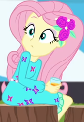 Size: 340x491 | Tagged: safe, screencap, fluttershy, equestria girls, equestria girls specials, g4, my little pony equestria girls: better together, my little pony equestria girls: sunset's backstage pass, clothes, cropped, cup, dress, drink, female, hairclip, long sleeves, looking back, looking up, rv, sitting, tree stump, waistband, wide eyes