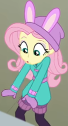 Size: 427x787 | Tagged: safe, screencap, fluttershy, blizzard or bust, equestria girls, equestria girls series, g4, holidays unwrapped, spoiler:eqg series (season 2), bird whistle, bunny ears, clothes, coat, cropped, cute, female, leg warmers, looking down, mittens, shirt, shyabetes, undershirt, waistband, winter hat, winter outfit