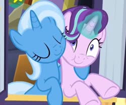 Size: 640x536 | Tagged: safe, screencap, starlight glimmer, trixie, pony, g4, road to friendship, cropped, cute, duo, eyes closed, hoof around neck, hug, smiling, snuggling, squishy cheeks, trixie's wagon