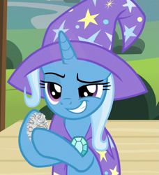 Size: 657x720 | Tagged: safe, screencap, trixie, pony, unicorn, g4, uncommon bond, cape, clothes, cropped, female, hat, holding, mare, raised eyebrow, raised hoof, solo, trixie's cape, trixie's hat