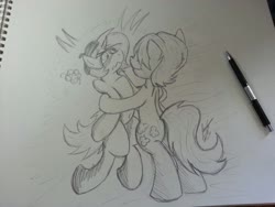 Size: 816x612 | Tagged: safe, artist:lucas_gaxiola, oc, oc:charmed clover, earth pony, pony, unicorn, bipedal, black and white, blushing, gay, grayscale, hug, irl, male, monochrome, pencil, photo, stallion, traditional art
