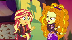 Size: 1920x1080 | Tagged: safe, screencap, adagio dazzle, sunset shimmer, equestria girls, equestria girls series, g4, sunset's backstage pass!, spoiler:eqg series (season 2), bracelet, clothes, female, geode of empathy, jacket, jewelry, leather jacket, magical geodes, music festival outfit, shorts, spiked wristband, wristband