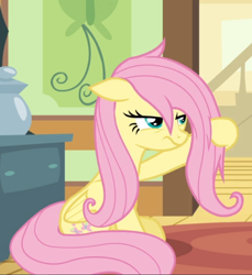 Size: 682x744 | Tagged: safe, screencap, fluttershy, pegasus, pony, flutter brutter, g4, cropped, female, floppy ears, fluttershy is not amused, mare, messy mane, narrowed eyes, sitting, solo, unamused