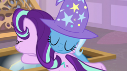 Size: 1920x1080 | Tagged: safe, screencap, starlight glimmer, trixie, pony, unicorn, g4, the ending of the end, clothes, eyes closed, female, hat, hug, mare, smiling, trixie's hat