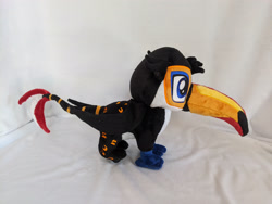 Size: 4032x3024 | Tagged: safe, artist:dungeondwellerrescue, oc, oc only, oc:tristão, bird, griffon, ocelot, toco toucan, toucan, toucan griffon, beak, commission, folded wings, irl, male, paws, photo, plushie, solo, spots, standing, talons, wings