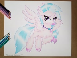 Size: 4032x3024 | Tagged: safe, artist:maximustimaeus, silverstream, hippogriff, g4, bedroom eyes, claws, colored pencil drawing, colored pencils, cute, diastreamies, female, flying, hooves, jewelry, simple background, smiling, solo, traditional art, white background, wings