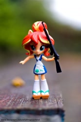 Size: 1024x1544 | Tagged: safe, artist:artofmagicpoland, sunset shimmer, equestria girls, g4, doll, gun, implied twilight sparkle, photo, solo, sunset sushi, toy, weapon