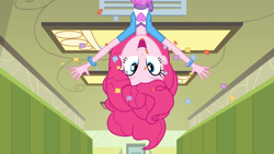 Size: 1920x1080 | Tagged: safe, screencap, pinkie pie, equestria girls, friendship games, g4, air vent, arms in the air, bracelet, canterlot high, clothes, confetti, excited, female, hallway, happy, jewelry, looking at you, open mouth, shirt, skirt, teenager, upside down, vest, waving
