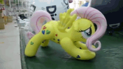 Size: 400x224 | Tagged: safe, fluttershy, inflatable pony, pegasus, pony, g4, animated, bootleg, flutterrage, hongyi, inflatable, inflatable pegasus, inflatable toy, irl, iwtcird, meme, photo, solo, sound, webm