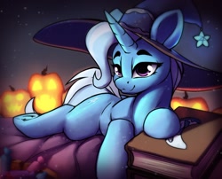 Size: 1836x1483 | Tagged: safe, artist:hitbass, trixie, pony, unicorn, g4, book, candy, female, food, halloween, hat, holiday, jack-o-lantern, lying down, mare, prone, pumpkin, solo, witch hat