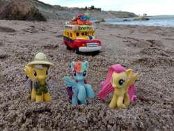 Size: 2048x1536 | Tagged: safe, artist:dingopatagonico, daring do, fluttershy, rainbow dash, pony, g4, beach, bus, irl, ocean, photo, sand, toy