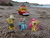 Size: 2048x1536 | Tagged: safe, artist:dingopatagonico, daring do, fluttershy, rainbow dash, pony, beach, bus, irl, ocean, photo, sand, toy
