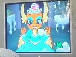 Size: 320x240 | Tagged: safe, screencap, smolder, dragon, g4, what lies beneath, clothes, discovery kids, discovery kids logo, dragoness, dress, female, food, photo, picture of a screen, princess smolder, puffy sleeves, solo, tea