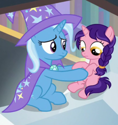 Size: 620x658 | Tagged: safe, screencap, raspberry dazzle, trixie, pony, unicorn, g4, the ending of the end, cape, clothes, cropped, female, filly, hat, holding a pony, looking down, trixie's cape, trixie's hat