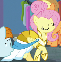 Size: 1082x1093 | Tagged: safe, screencap, applejack, fluttershy, joan pommelway, earth pony, pony, fake it 'til you make it, g4, clothes, cropped, dress, eyes closed, female, mare, raised hoof, rarity for you, solo focus, warrior of inner strength, warriorshy