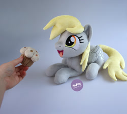 Size: 1400x1260 | Tagged: safe, artist:meplushyou, derpy hooves, pegasus, pony, g4, cute, derpabetes, food, hand, irl, lying down, muffin, photo, plushie, prone, solo
