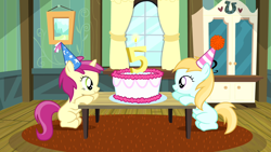 Size: 1280x720 | Tagged: safe, screencap, rose petal, rosy gold, earth pony, pony, unicorn, g4, pinkie pride, 5, birthday cake, birthday candle, birthday party, cake, female, filly, food, hat, hooves, house, living room, party, party hat, sitting, smiling, table, the super duper party pony