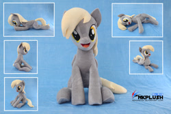 Size: 1280x854 | Tagged: safe, artist:nekokevin, derpy hooves, pegasus, pony, g4, :d, cute, derpabetes, female, irl, looking at you, lying down, mare, obtrusive watermark, open mouth, photo, plushie, prone, side view, sitting, smiling, solo, underhoof, watermark