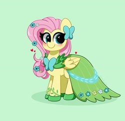 Size: 3200x3100 | Tagged: safe, artist:kittyrosie, fluttershy, pegasus, pony, g4, blushing, clothes, cute, dress, female, flower, flower in hair, gala dress, green background, green eyes, heart, high res, looking at you, mare, shyabetes, simple background, smiling, solo