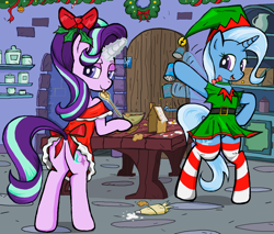 Size: 1670x1420 | Tagged: safe, artist:sallycars, starlight glimmer, trixie, pony, unicorn, g4, baking, bipedal, butt, christmas, clothes, cooking, dress, female, festive, gingerbread house, glowing horn, holiday, hoof hold, horn, icing bag, looking at you, looking back, looking back at you, magic, mare, ms paint, plot, socks, striped socks, telekinesis, tongue out, waving